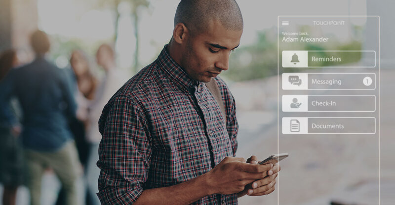 A young man uses an electronic monitoring mobile app to respond to a message from his parole officer.